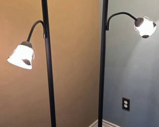 Lot 105: Pair of black floor lamps with dual light heads