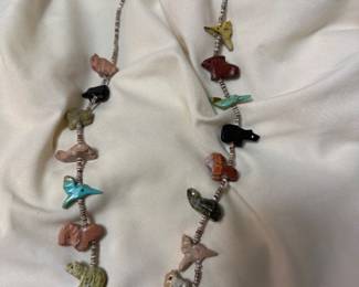 Vintage Zuni Fetish Necklace — single strand heishi with ~20 hand-carved animal fetishes in varied stone (serpentine, jasper, jet, mother-of-pearl, turquoise), silver hook clasp. 23.0g.