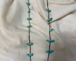 Vintage Zuni Fetish Necklace — single strand heishi with 12+ hand-carved turquoise animal fetishes, silver clasp with illegible hallmark. 18.9g.