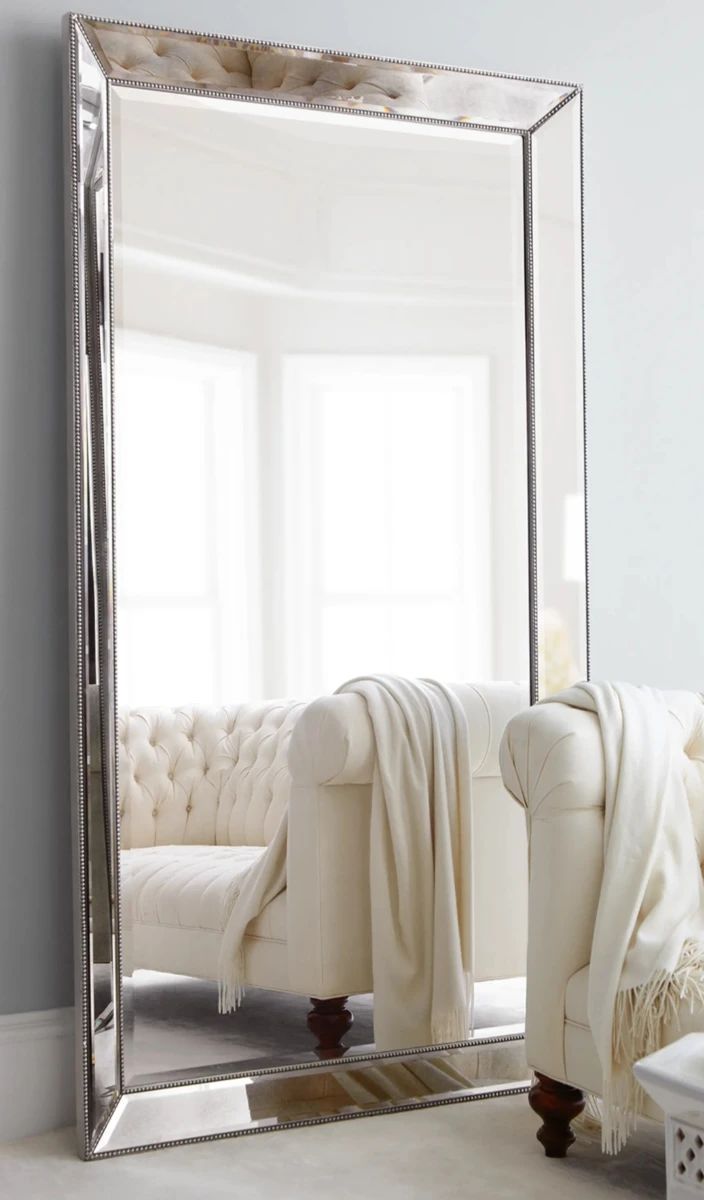 Large vintage silver leaning beveled mirrors 