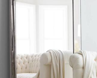 Large vintage silver leaning beveled mirrors