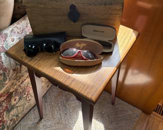 Side table with wood chest and sunglasses