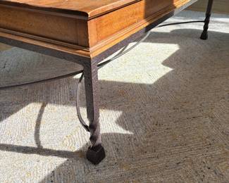iron legged table with maple top -some distress on top of table 