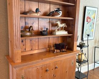  pine cabinet with bookcase with three shelves with plate racks, and decoy and horse decor items
