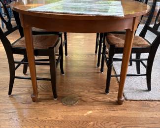 oval Maple table with turned legs shown with pottery barn dining chairs with rush seats