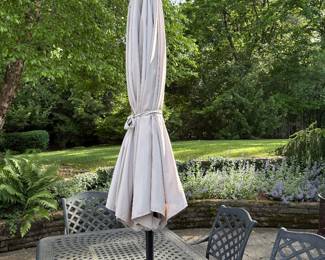 Umbrella with stand to accompany the patio dining table