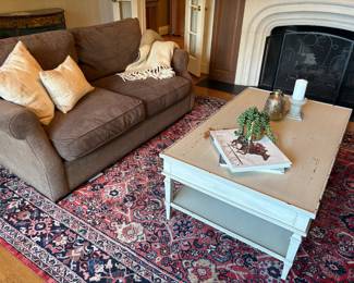 Chocolate Chenille 2-cushion couch, !00% wool area rug (9 x 11.5) hand-made hand-tied, ivory distressed wood coffee/cocktail table