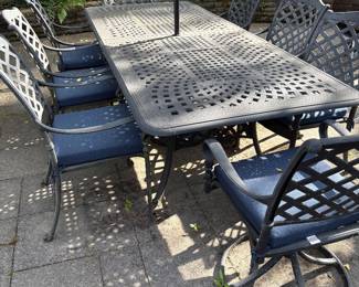 Cast Aluminum patio table with 2 leaves and 8 chairs, patio umbrella and umbrella stand