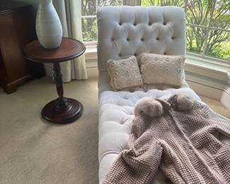 Ivory chaise lounger and side table with leather top, and shown with faux fur jackets (women's size M)