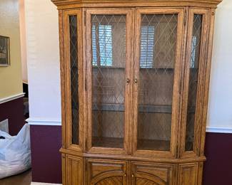 Solid oak china cabinet with glass shelves and interior shelving