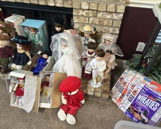 Porcelain dolls, sealed wheatie’s boxes