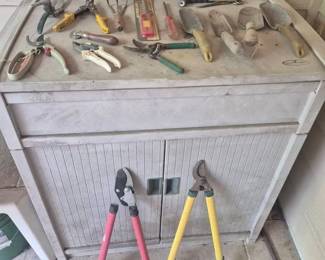 Suncast resin storage cabinet With Gardening Tools