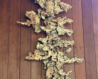 Molten metal wall sculpture by Silas Seandel