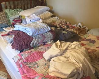 Hand stitched quilts and linens
