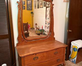 Oak dresser with mirror. Very sturdy. Drawers work well.