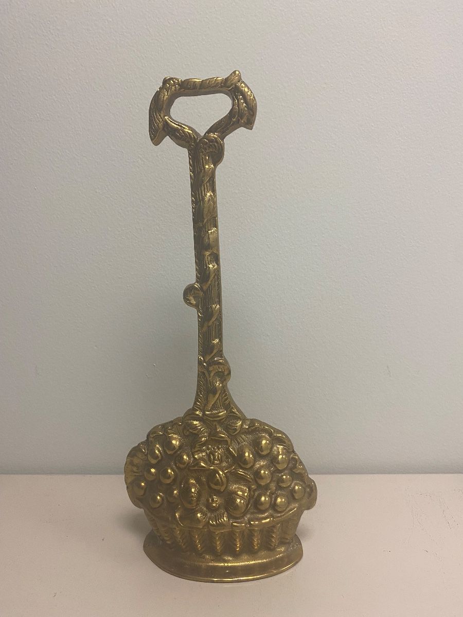 Vintage brass doorstop.