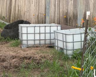 Tubs for storage or livestock. Firewood