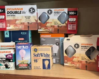 Lot 247: Assorted household items: lighting bulbs and laundry textiles