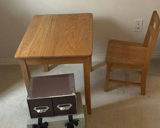 Lot 257: Wooden dining table with chair and stacked storage boxes