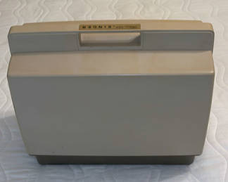 Lot 65: Singer Sewing Machine Case with Manuals and Accessories