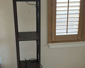 Lot 254: Tall dark wood ladder-style bookshelf with vacuum