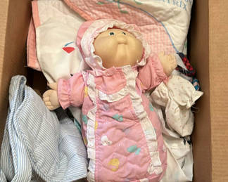 Lot 121: Baby Doll, Infant Clothing, Bottle Holder, and Peter Rabbit Quilt