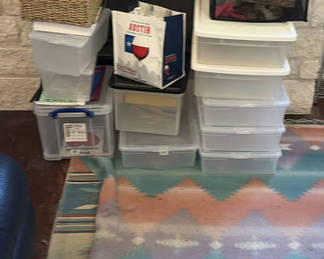 Lot 240: Stacked plastic storage boxes with baskets and organizers