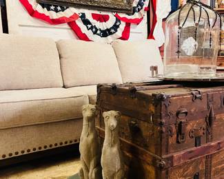 Pair concrete dogs plus beautiful sofa