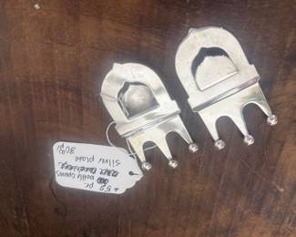 Item 52 $30.00 pair silver plate bottle openers