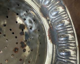 Item 76 unmarked tea strainer discoloration on finish $ 30.00