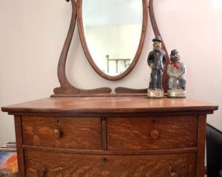 Antique three drawer Tiger Oak dresser with oval mirror 