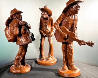 Three moulded cowboy figurines 