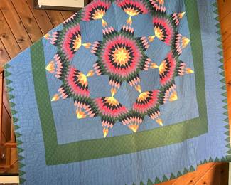 Lone Star or Broken Star pattern quilt