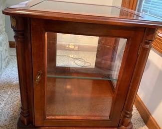 2 of these small curio cabinets