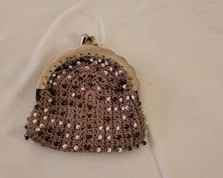 Vintage beaded crochet coin purse with a scalloped metal KISS lock frame. Steam punk