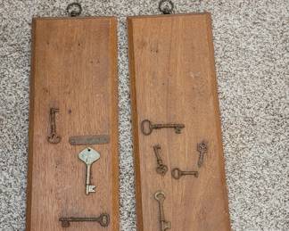 Antique skeleton keys mounted on wooden plaques ready for hanging