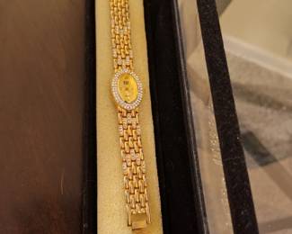 Elizabeth Taylor white diamonds quartz, gold tone oval faced, watch