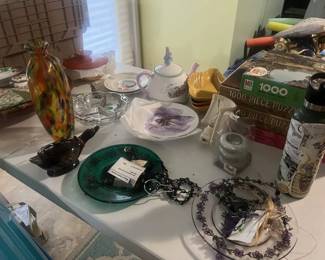 Handmade bird feeders, as well as decorative vase, dishes, and tea kettle