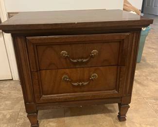 One of a set of two wooden side tables
