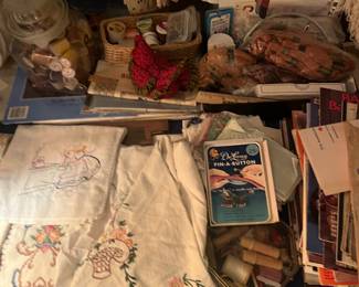 Embroidered tea towels and pillow cases.