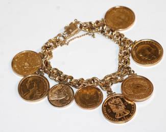 14kt Gold Charm Bracelet with 8 antique Gold Coins 84.6 grams total weight; 1927 2.5 dollar Indian Head (weighs 4.19 grams) , 1901 5 dollar Liberty Head (8.35 grams) 1857 10 Francs Napoleon 3rd, 1914 20 Francs Albert Koning ( 6.44 grams), 1897 10G KoningRijkDer Nederlanden (6.71 grams), 1882 L20 Umberto the First Re D'italia (6.44 grams) 1927 22K GOLD Coin Georgivs V.D.G Britt OMN REX F.D. IND IMP, 1927 B 20FR Helvetia (7.96 grams)