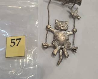 Cat on a swing pin