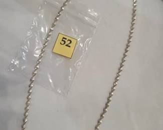 Silver neck chain with a twist