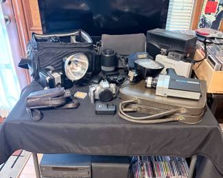 Vizio television, cameras, panasonic stereo with multi-disc changer 