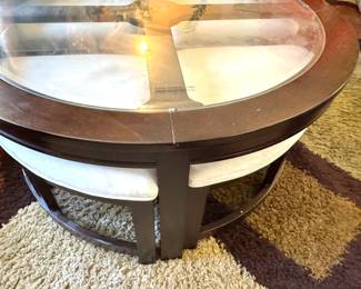 American Signature Round Coffee Table with Glass Insert and Upholstered Accent Band, $175