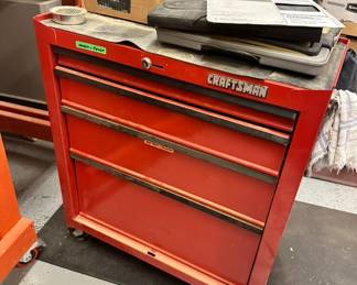 Craftsman rolling tool chests with items inside
