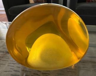 Signed yellow resin sculpture.....