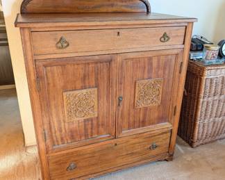 antique jelly cabinet, features carved wooden details