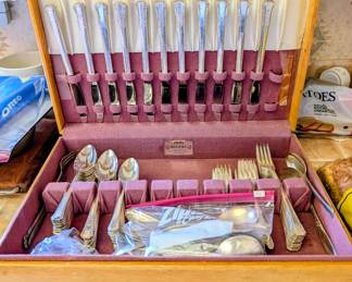 vintage silverware storage chest with flatware set