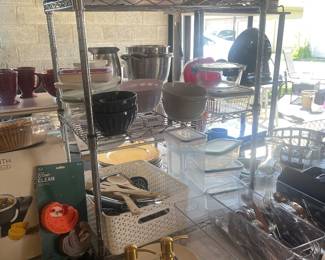Storage containers, pyrex, kitchen utensils, flatware, forks, spoons, knives 